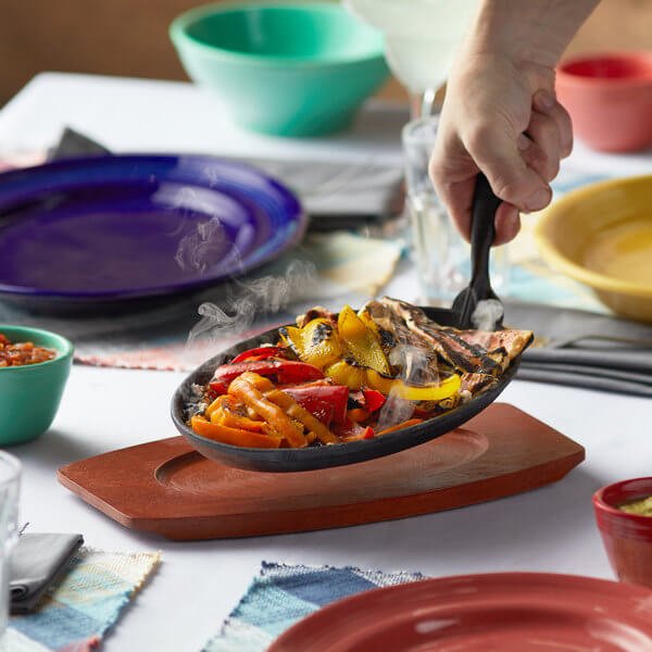 Oval Cast Iron Fajita Skillet with Gripper and Wood Underliner 12 5/8" x 7 1/8" - Best before food