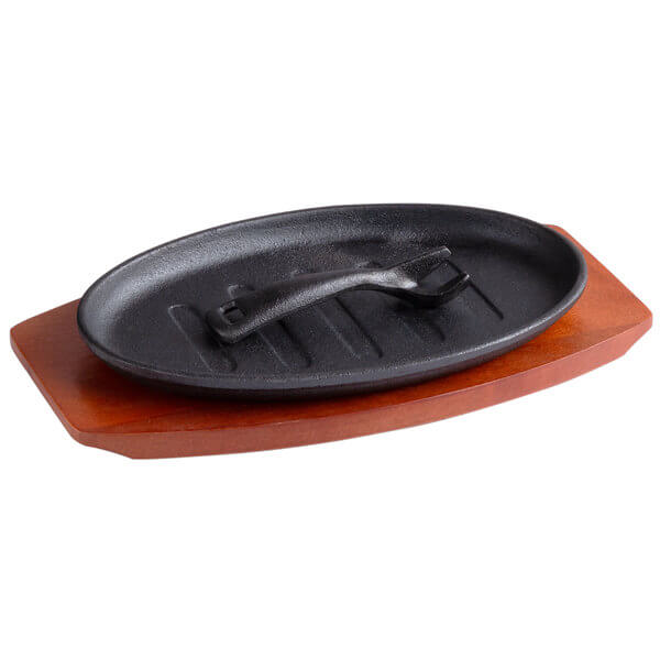 Oval Cast Iron Fajita Skillet with Gripper and Wood Underliner 12 5/8" x 7 1/8" - Best before food